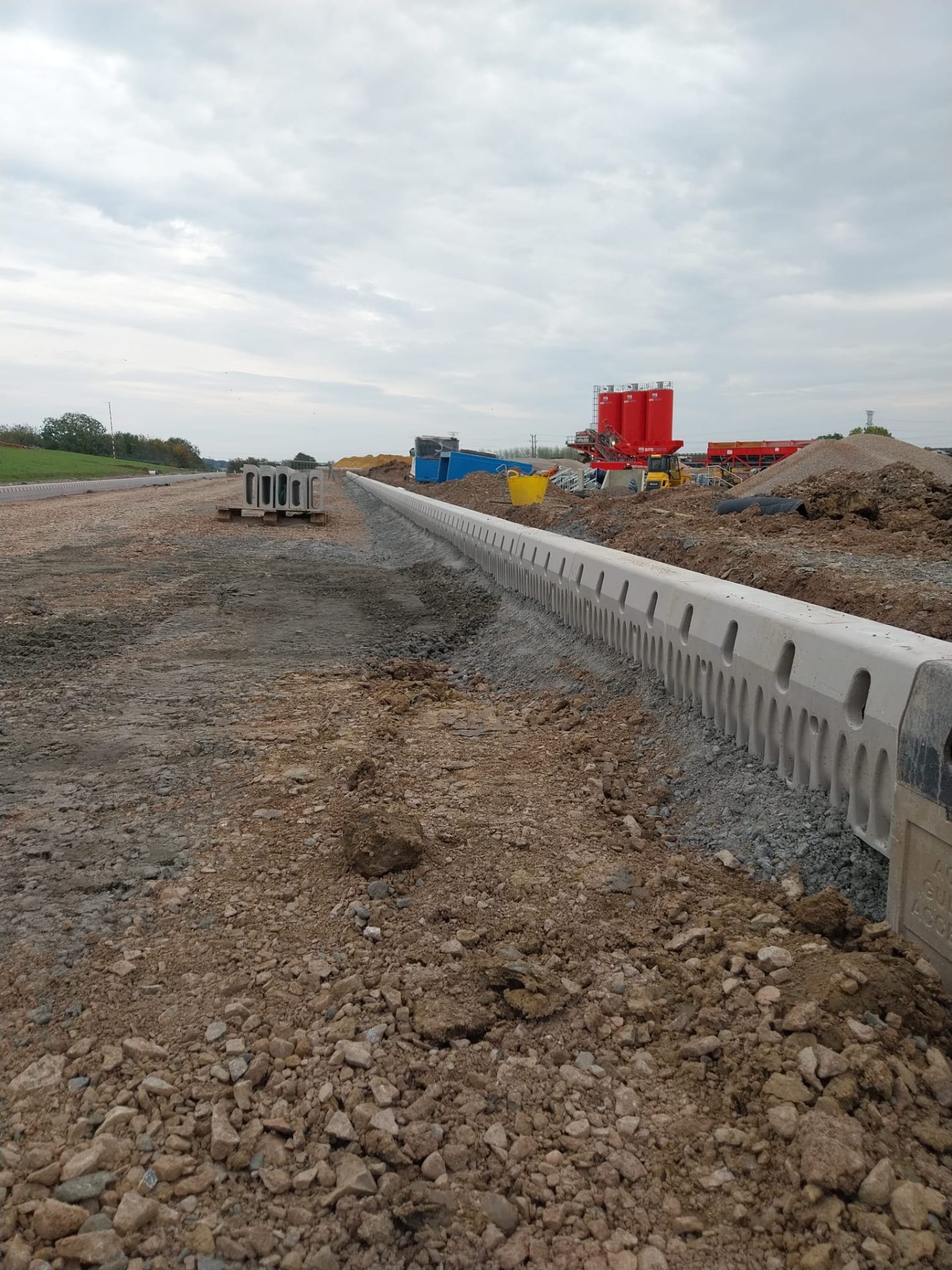 Machinery on active kerb laying site